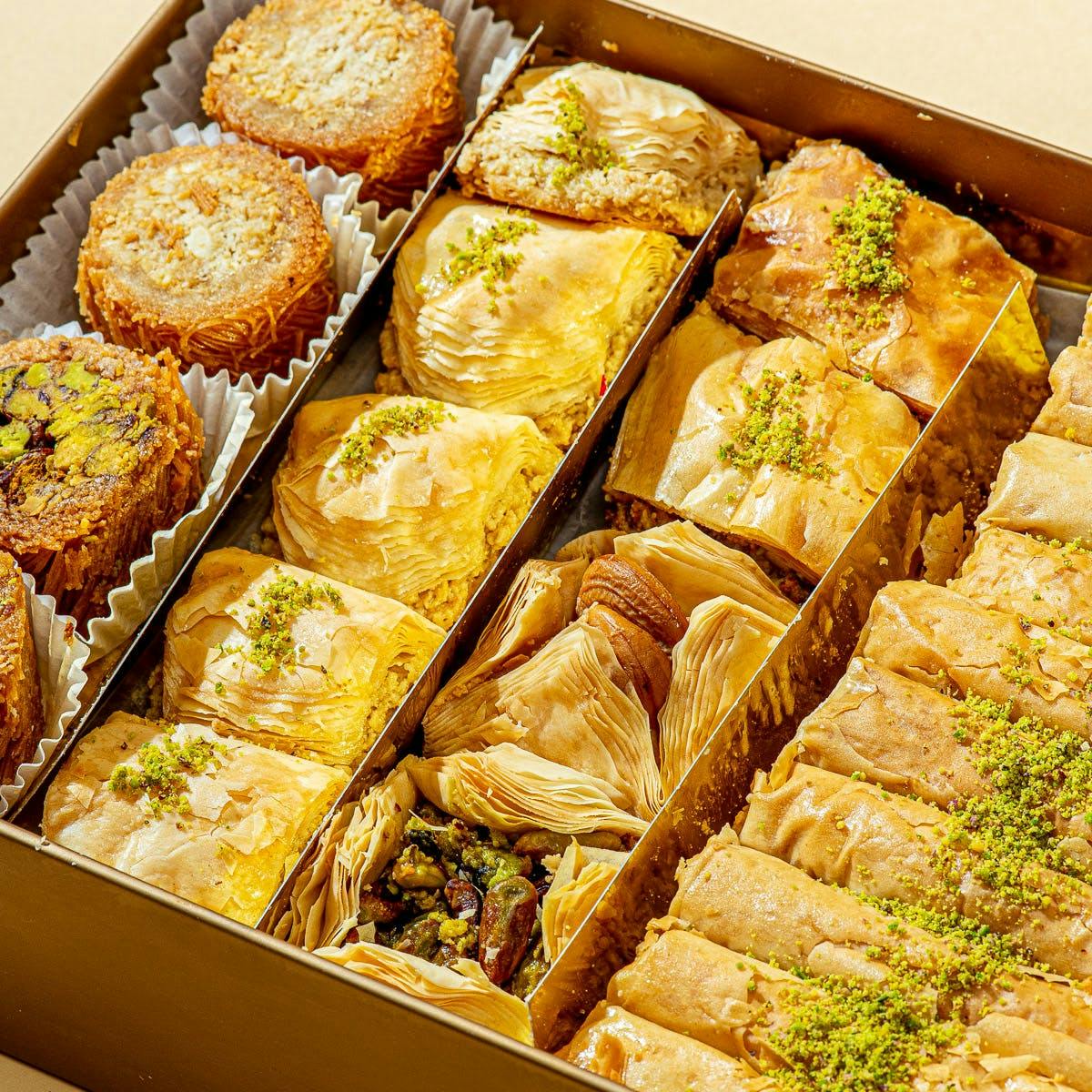 https://goldbelly.imgix.net/uploads/showcase_media_asset/image/106303/baklava-decorated-full-elegant-box-55-pieces.4f400974ad7661aed7ed35e2a7408d77.jpg?ixlib=rails-3.0.2