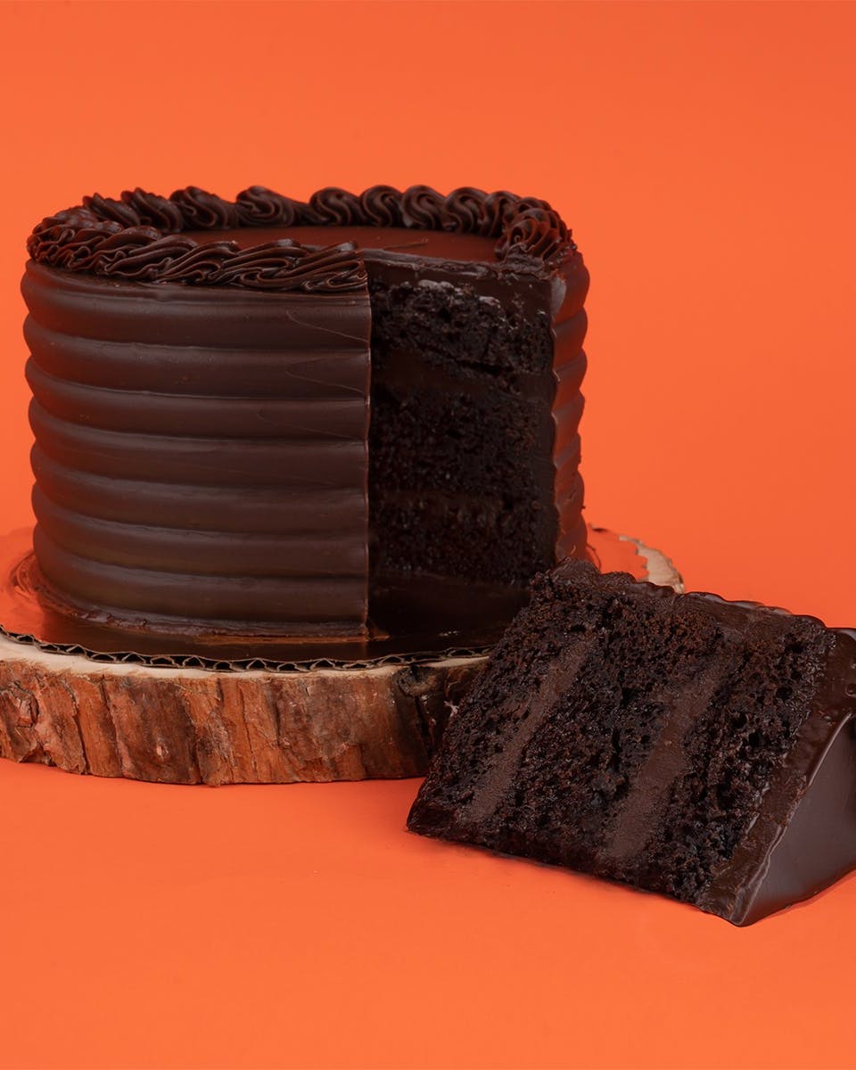 https://goldbelly.imgix.net/uploads/showcase_media_asset/image/117940/chocolate-fudge-cake-8.8b8a6b0d787c2a69513e637f8d063c7f.jpg?ixlib=react-9.0.2&auto=format&ar=4%3A5