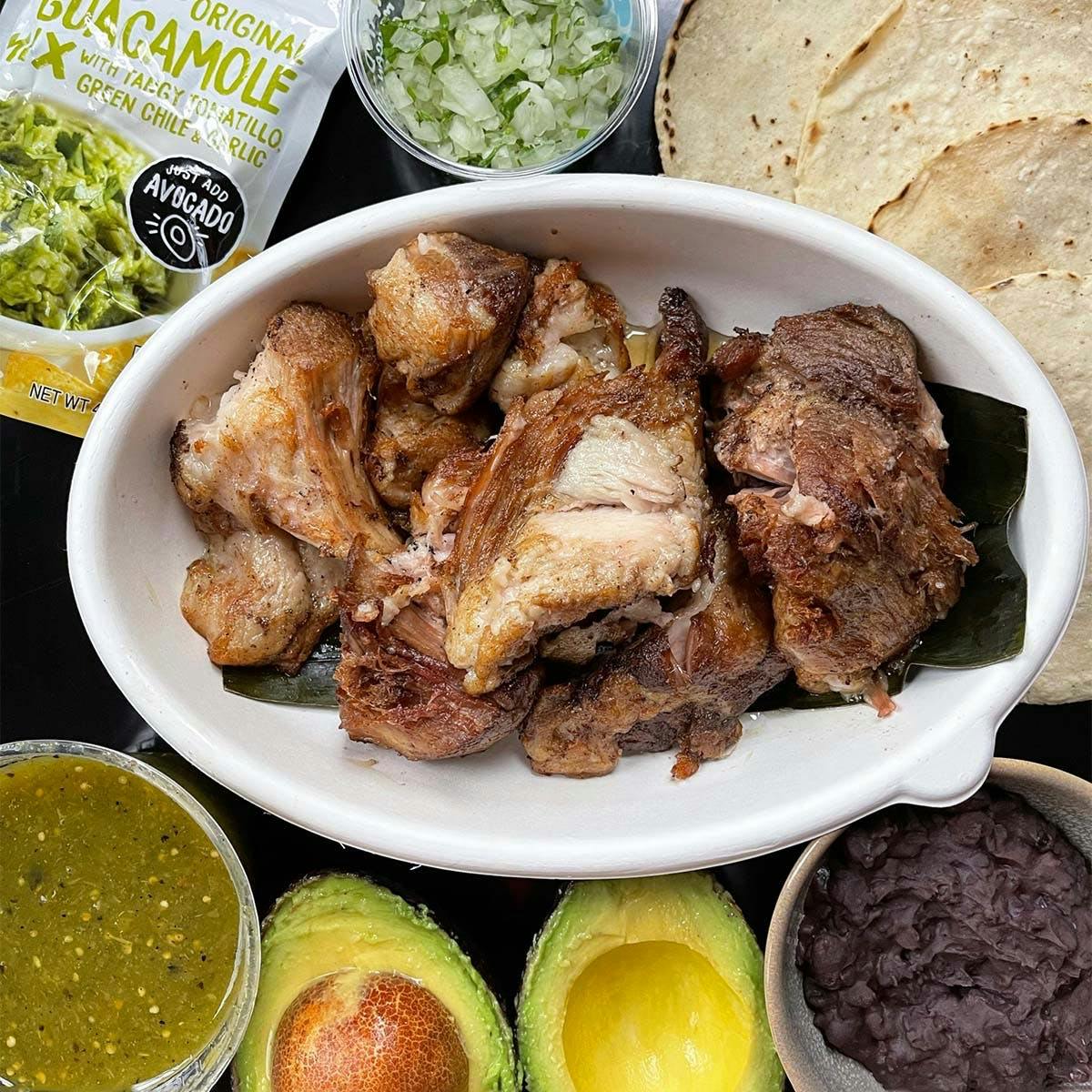 https://goldbelly.imgix.net/uploads/showcase_media_asset/image/122302/carnitas-taco-kit-for-4.353df56c909d2e16446dc569db961588.jpg?ixlib=rails-3.0.2