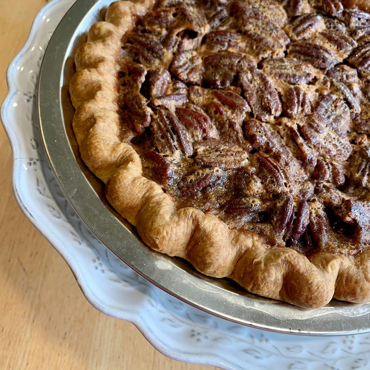 https://goldbelly.imgix.net/uploads/showcase_media_asset/image/132190/traditional-pecan-pie.f9797dc32a7635dbc8d3b49617016899.jpg?ixlib=react-9.0.2&auto=format&ar=1%3A1