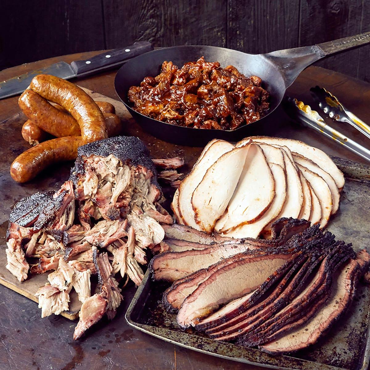 https://goldbelly.imgix.net/uploads/showcase_media_asset/image/133207/slaughterhouse-five-brisket-pork-sausage-turkey.28b91d5b2fdf226445bb9e1496f4b126.jpg?ixlib=rails-3.0.2