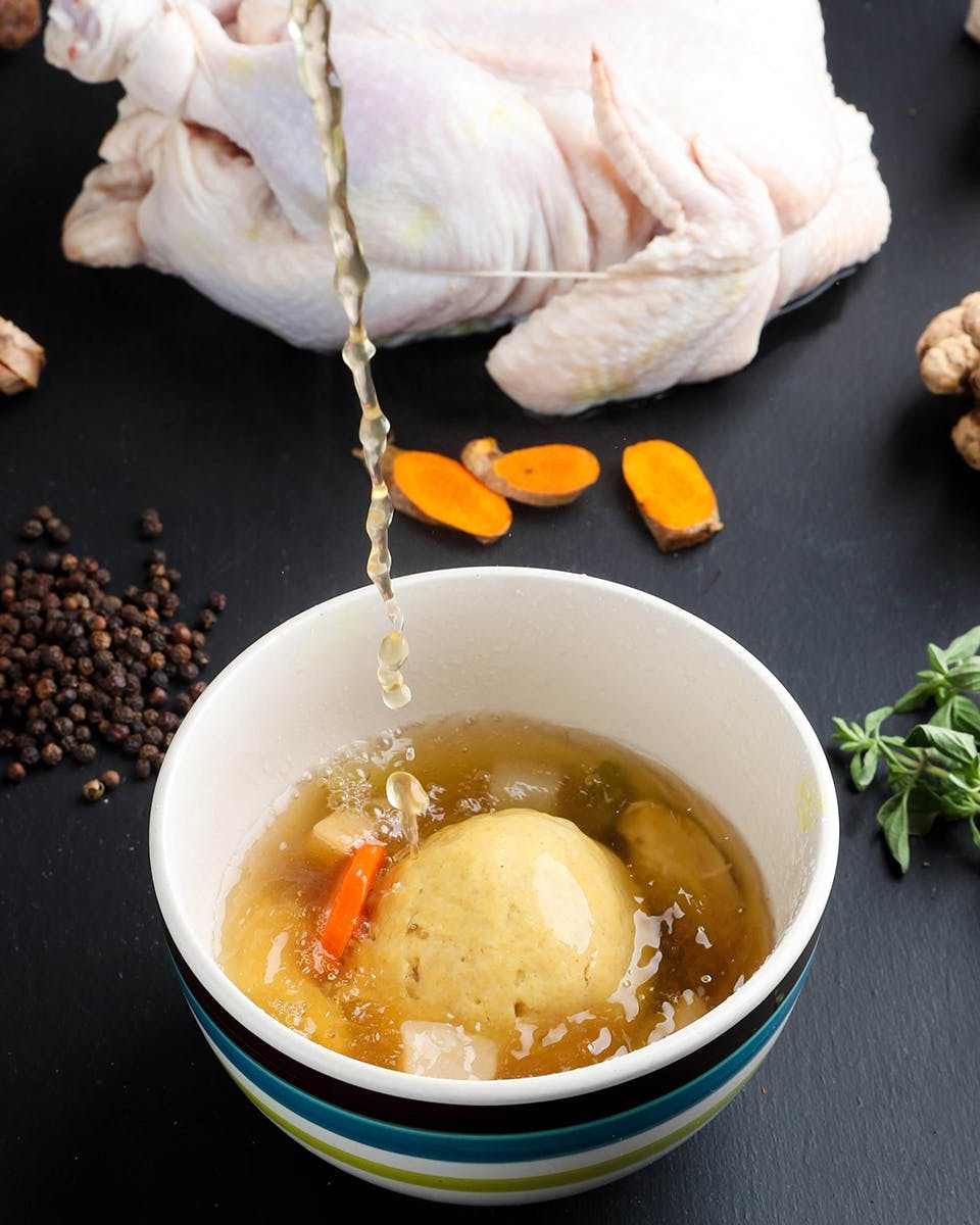 https://goldbelly.imgix.net/uploads/showcase_media_asset/image/134253/mamas-matzo-ball-immunity-soup.5b1d5ffc2d4be7c418b643b41b1e5b4e.jpg?ixlib=react-9.0.2&auto=format&ar=4%3A5