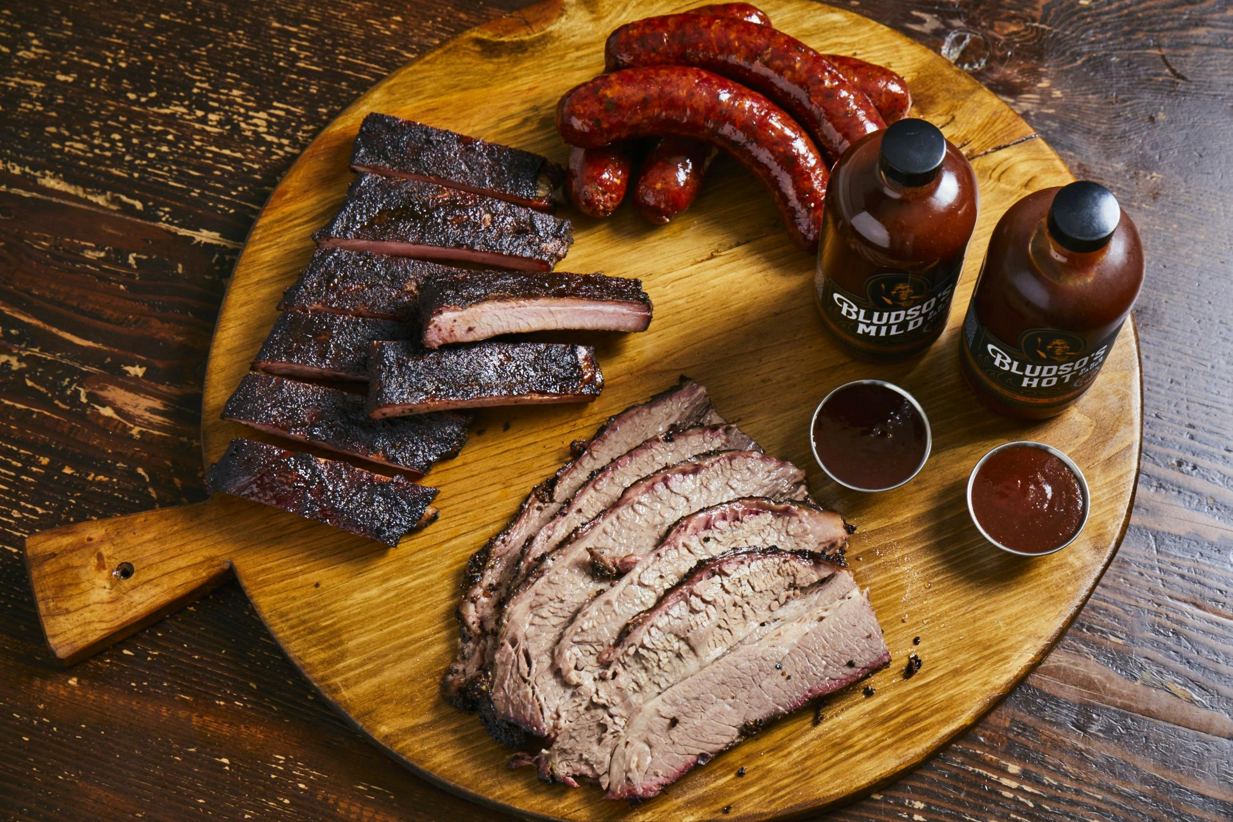 https://goldbelly.imgix.net/uploads/showcase_media_asset/image/134346/the-holy-trinity-bbq-combo-brisket-ribs-and-links.fb78fd456e069f565a0fdce876803430.jpg?ixlib=rails-3.0.2