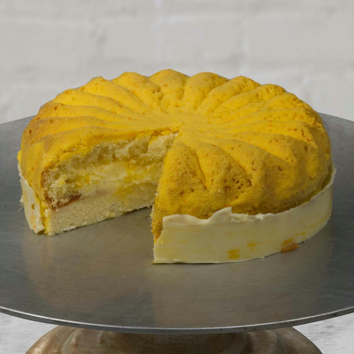 https://goldbelly.imgix.net/uploads/showcase_media_asset/image/162897/Knipschildt-Yellow-Dragon-Yuzu-Coconut-Sponge-Cake-2.jpg?ixlib=rails-3.0.2