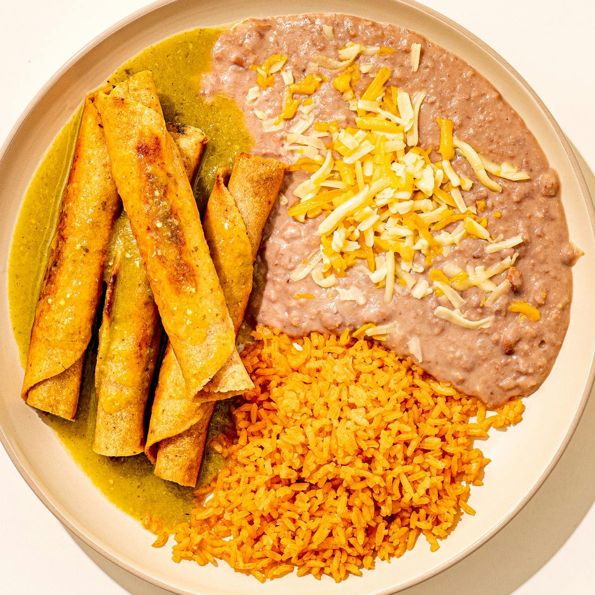 Beef Taquitos + Rice & Beans by Cielito Lindo