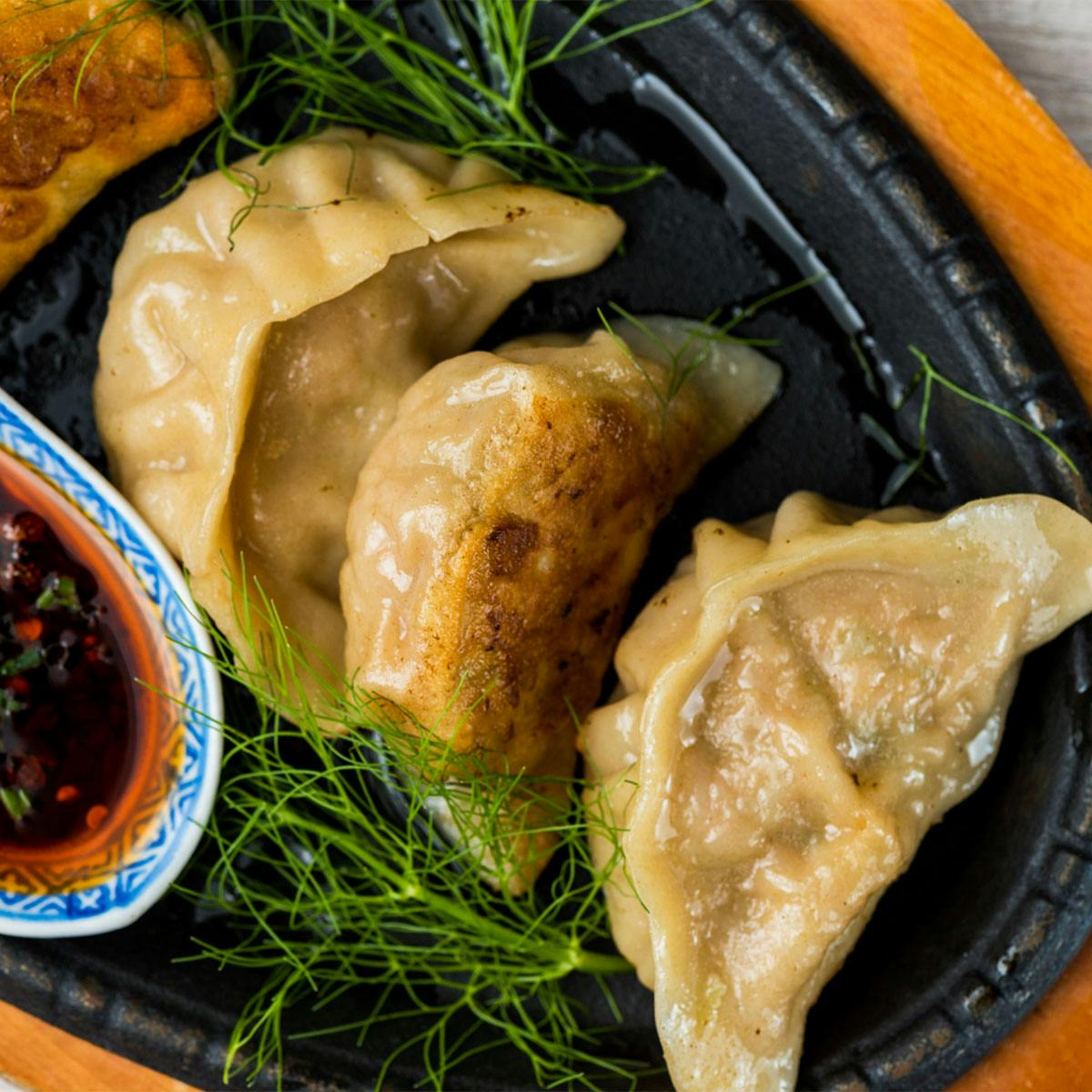 https://goldbelly.imgix.net/uploads/showcase_media_asset/image/174619/Shirley-Chung-Pork-Dumplings-2.jpg?ixlib=rails-3.0.2