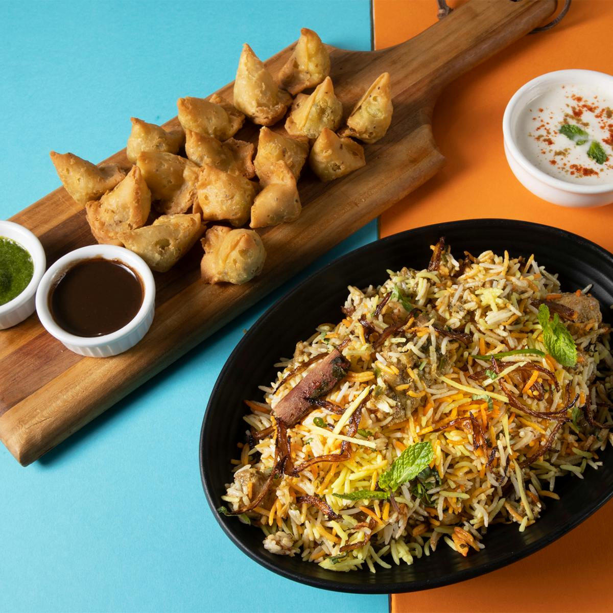 Lucknow Dum Chicken Biryani + Samosas for 4