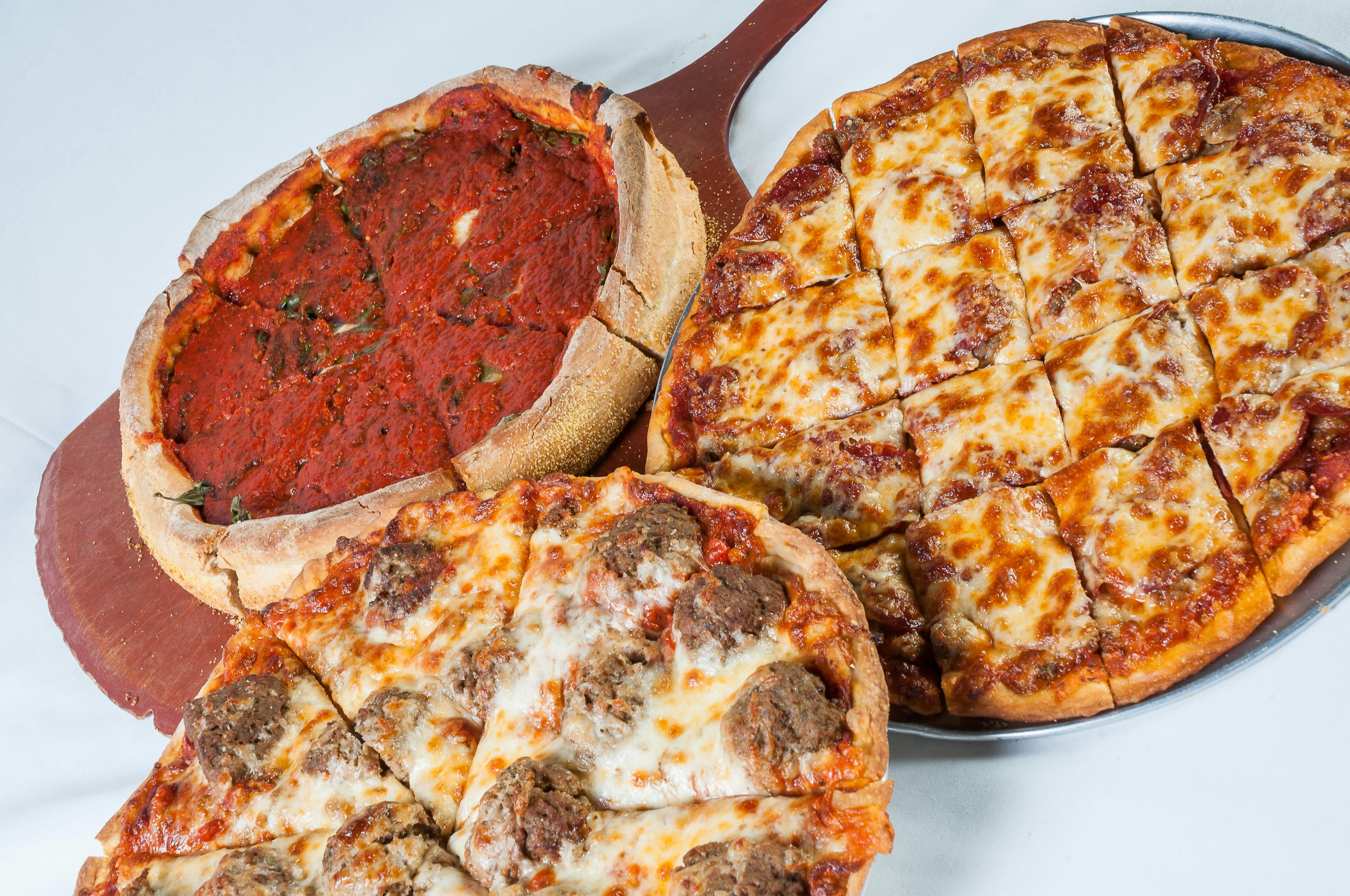 Choose Your Own Deep Dish + Thin Crust Pizza - Buy 2 Get 2 FREE by Bartolini’s