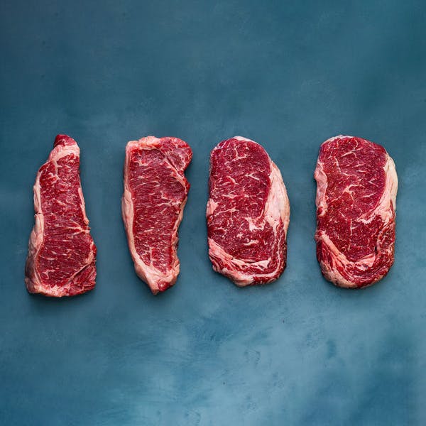 Akaushi Wagyu Boneless Ribeyes + NY Strip Steaks by Heritage Foods