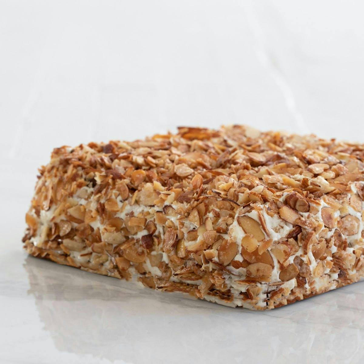 https://goldbelly.imgix.net/uploads/showcase_media_asset/image/67966/burnt-almond-torte.2a6b9891585e6574ed21fd0a59d3355c.jpg?ixlib=rails-3.0.2