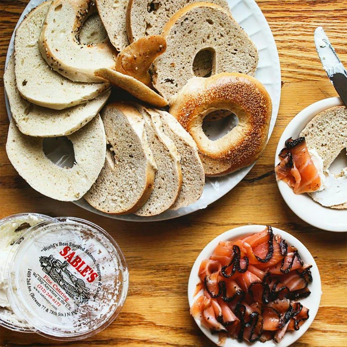 https://goldbelly.imgix.net/uploads/showcase_media_asset/image/89735/sables-smoked-fish-and-bagel-brunch-for-6.87294e857f76cb07ba5357c0ab93e863.jpg?ixlib=rails-3.0.2